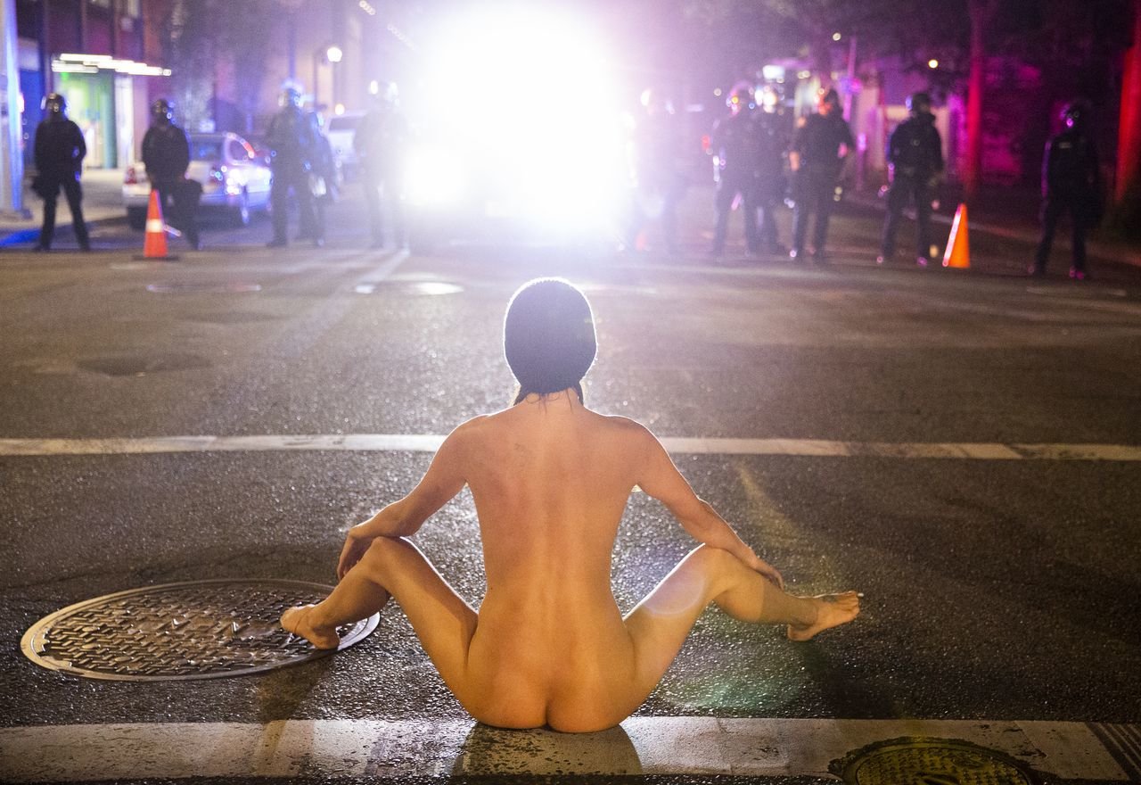 The story behind the surreal photos of Portland protester ‘Naked Athena’