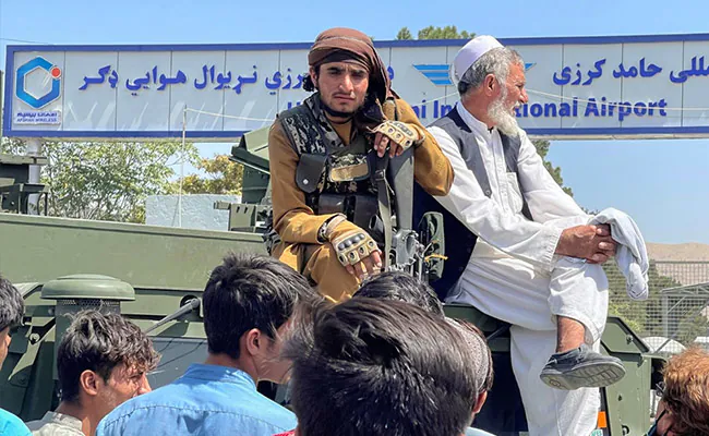 Taliban Go Door-To-Door Telling Fearful Afghans To Work