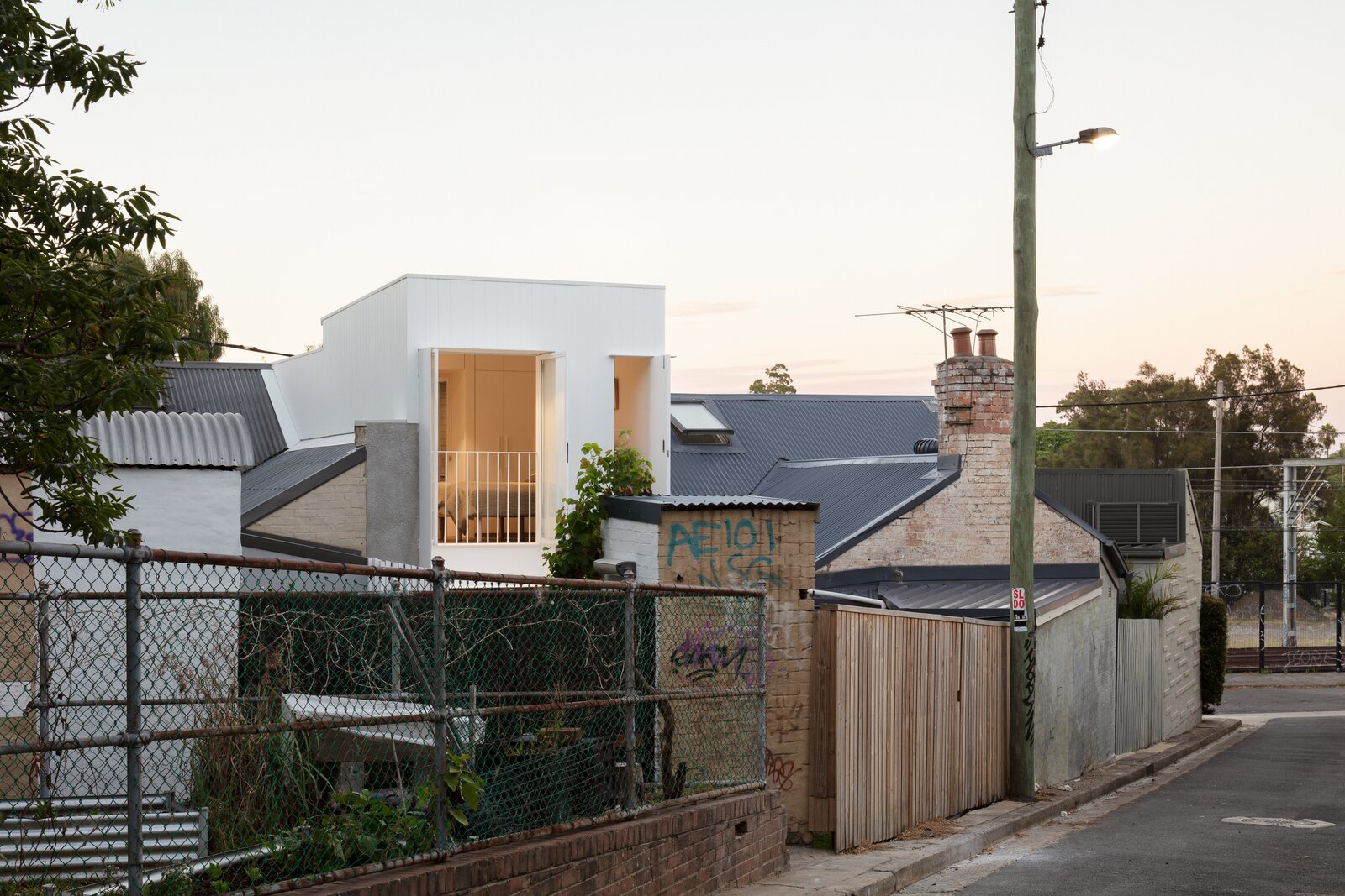 A Luminous Micro-Home Peeks Above the Rooftops in Sydney