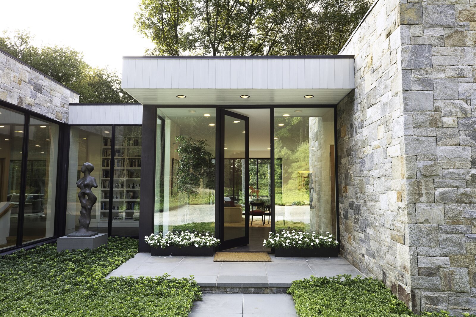 Art and Nature Converge at a Couple’s Glass, Cedar, and Stone House in New York