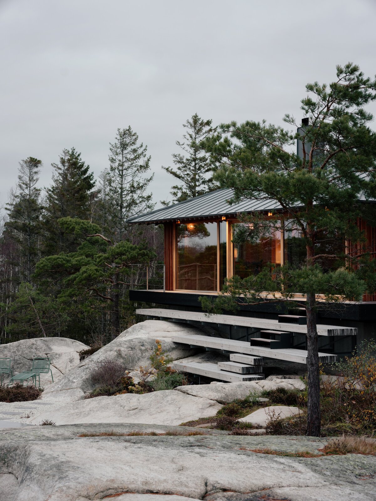 A Cedar-Clad Cabin With a Glass “Sunroof” Rises on a Hillside in Norway