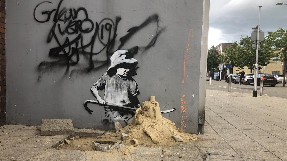 Banksy artwork removed from old electrical shop in Lowestoft
