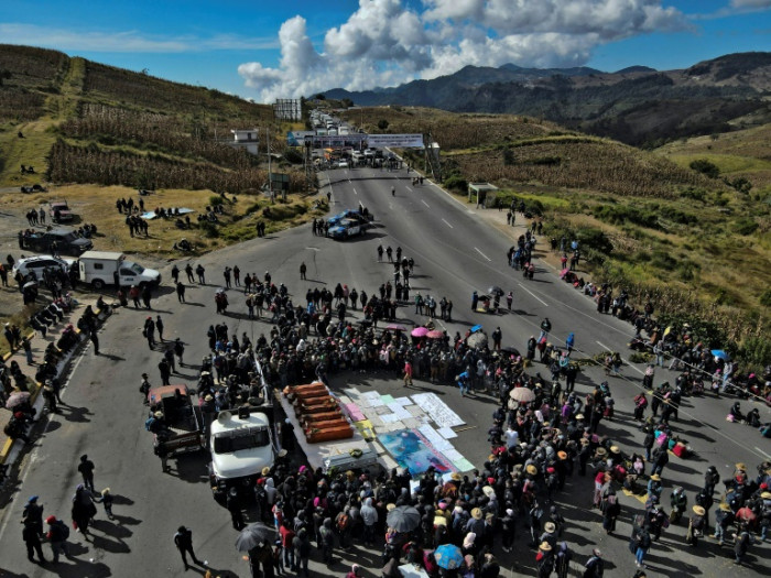 Families block road after bloody Guatemala village attack