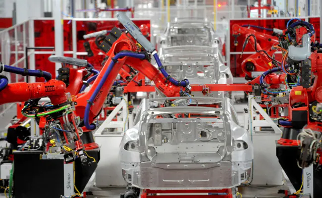 Elon Musk Faces Skeptics As Tesla Gets Ready To Unveil 'Optimus' Robot