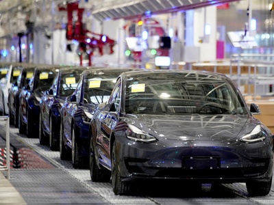 Tesla's China-made Model 3 vehicles are seen during a delivery event at its factory in Shanghai, China